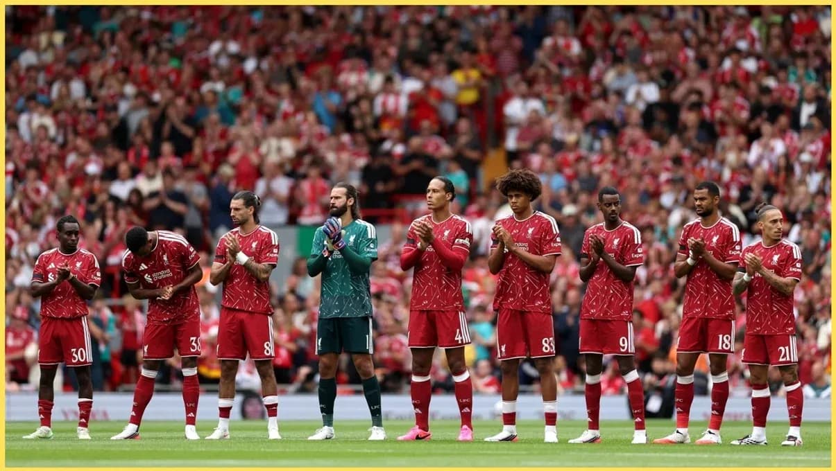 Liverpool players lined up applauding fans at Anfield Liverpool players lined up applauding fans at Anfield