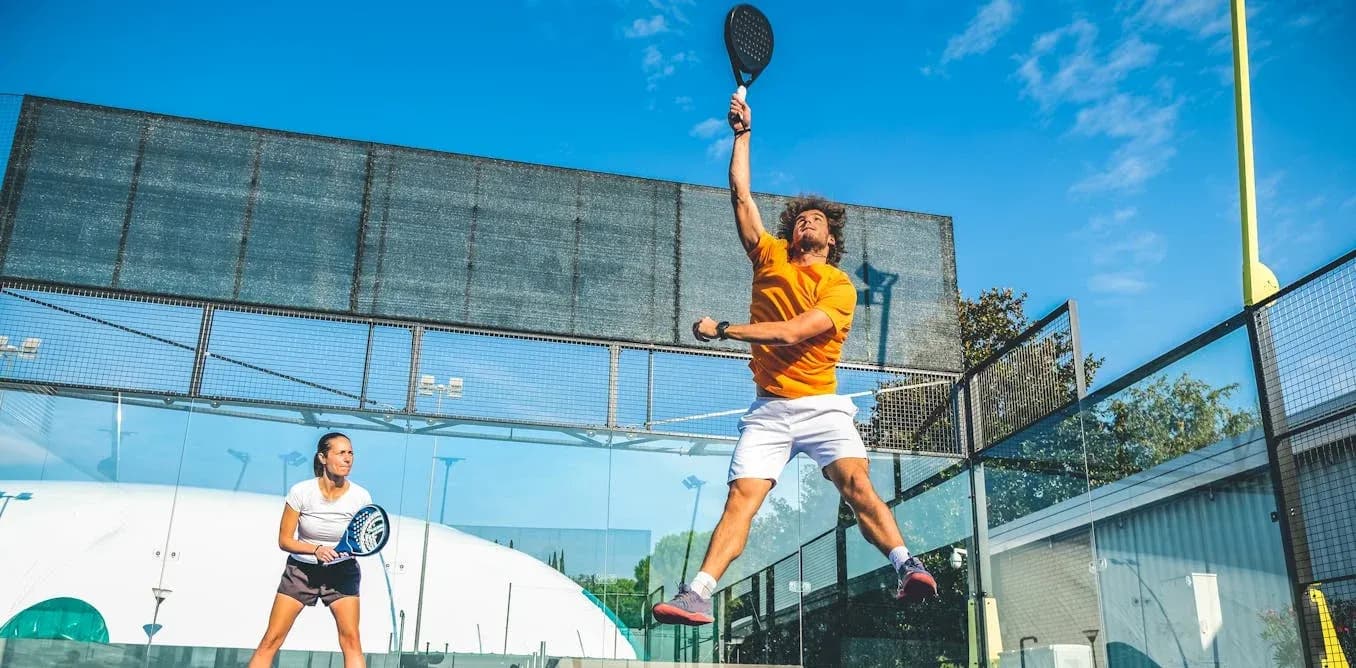 Tennis players competing on outdoor court Tennis players competing on outdoor court