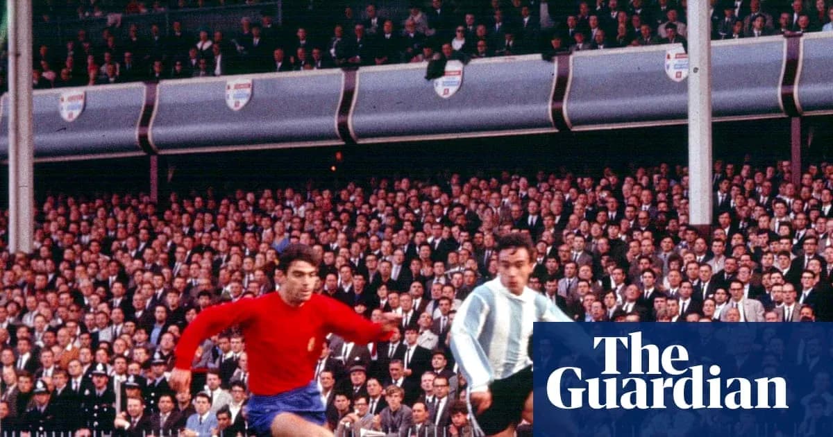 Two players competing during historic football match Two players competing during historic football match