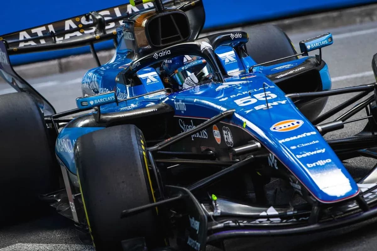 Formula 1 car speeding on racetrack Formula 1 car speeding on racetrack
