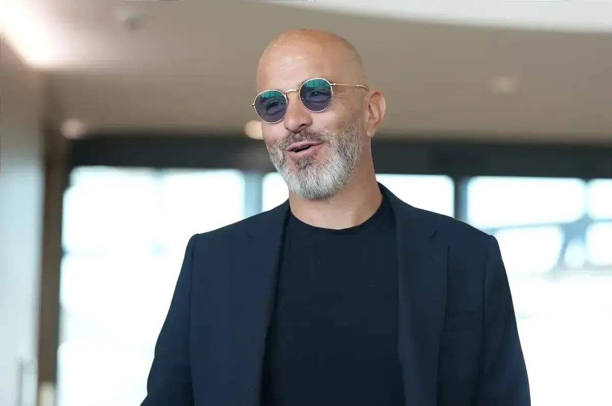 Man in sunglasses smiling in modern interior Man in sunglasses smiling in modern interior