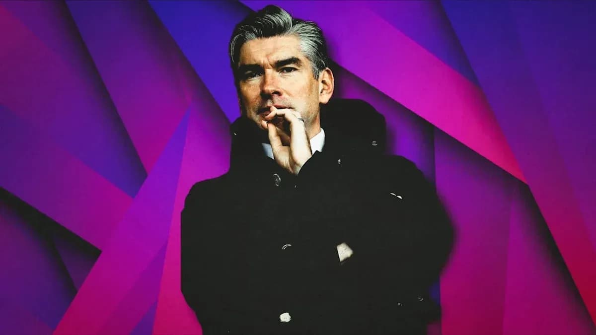 Man in coat with hand on chin, colorful background Man in coat with hand on chin, colorful background