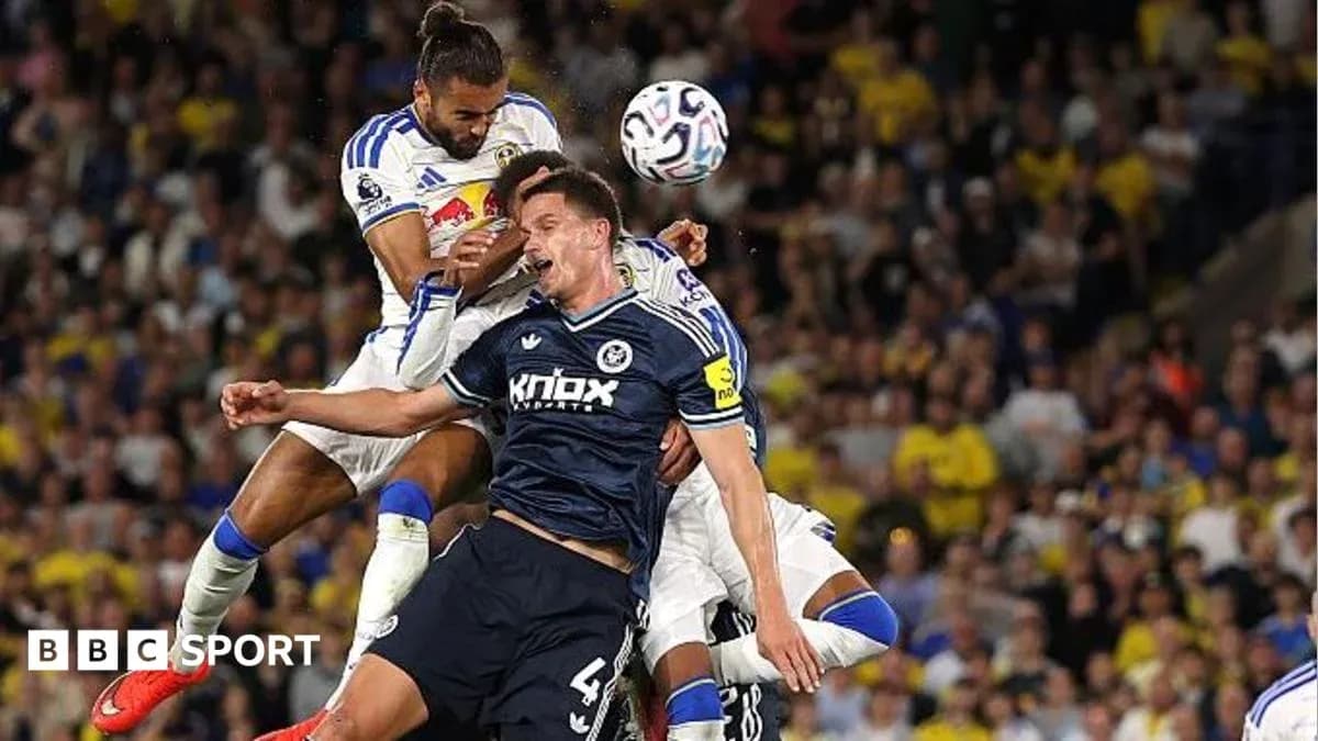 Two players contesting a high ball during match Two players contesting a high ball during match