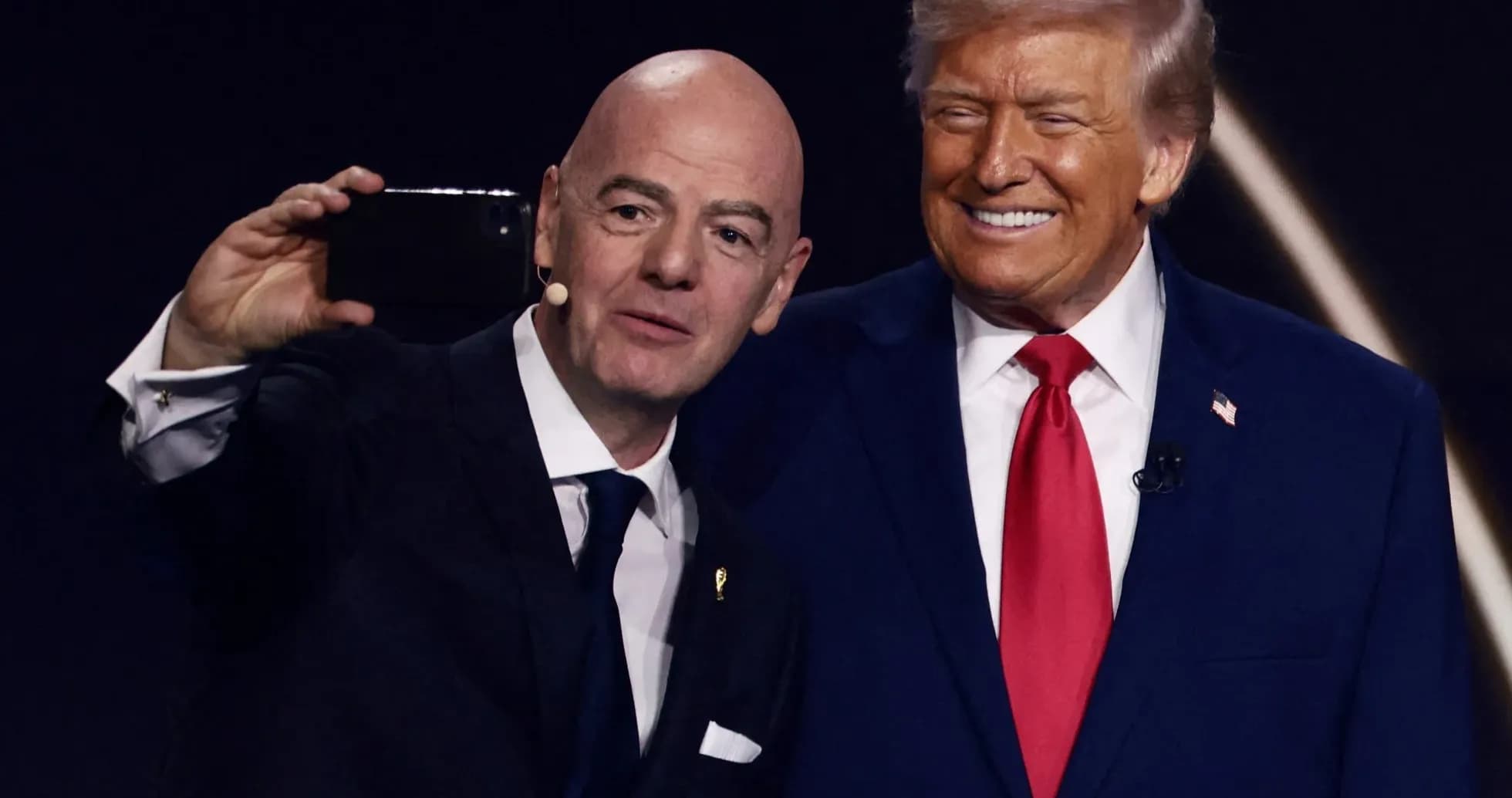 Two men taking a selfie at event Two men taking a selfie at event