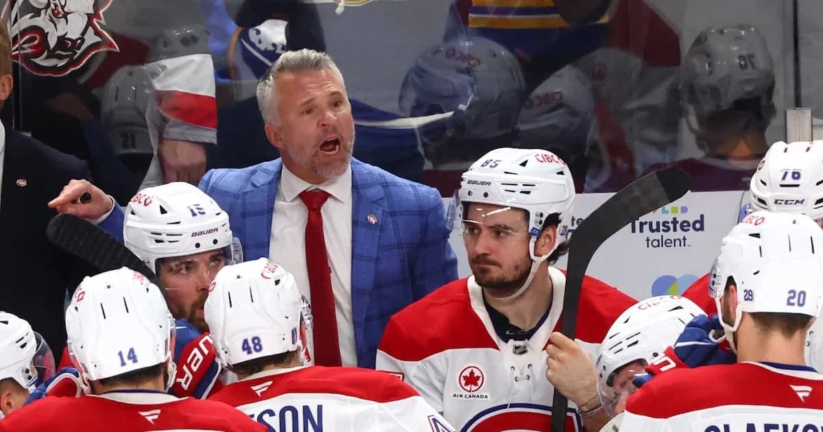 Hockey coach instructing players during timeout Hockey coach instructing players during timeout