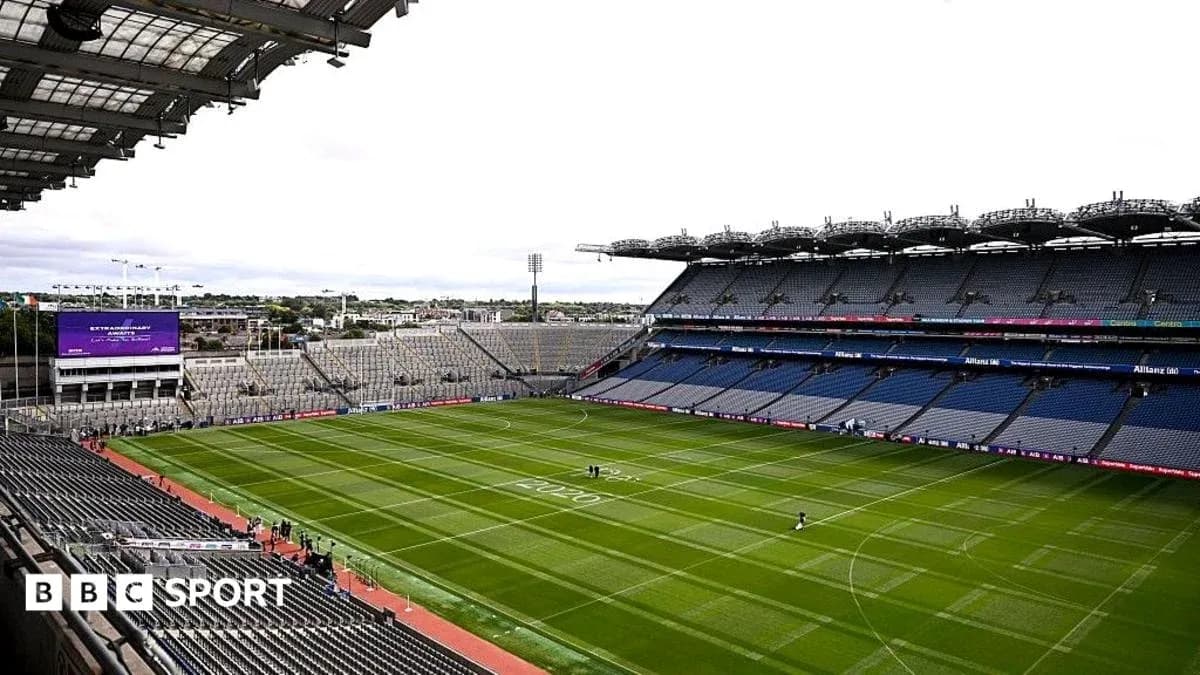 Croke Park stadium with empty stands and green pitch Croke Park stadium with empty stands and green pitch