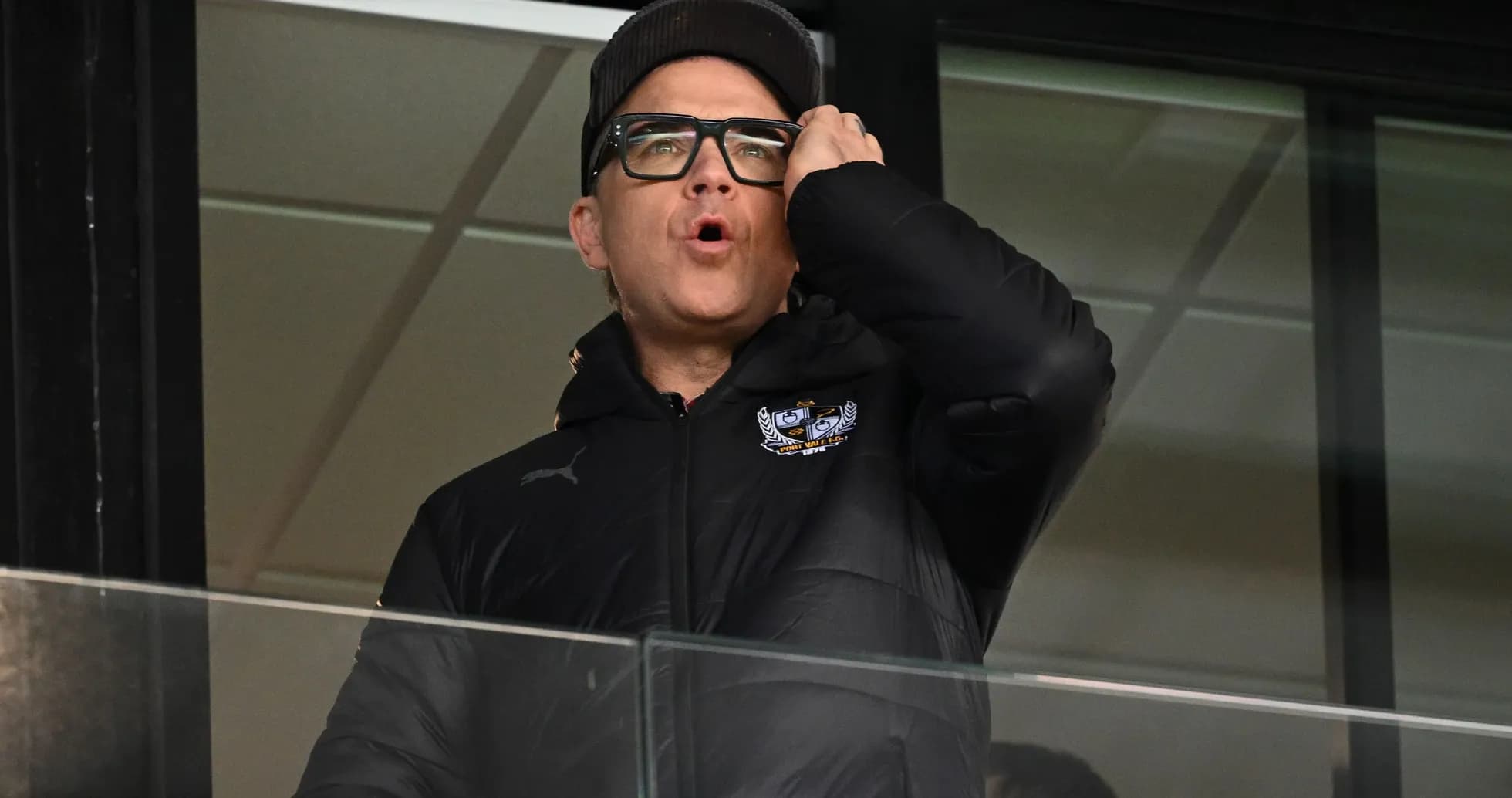 Person in booth shouting during the game Person in booth shouting during the game