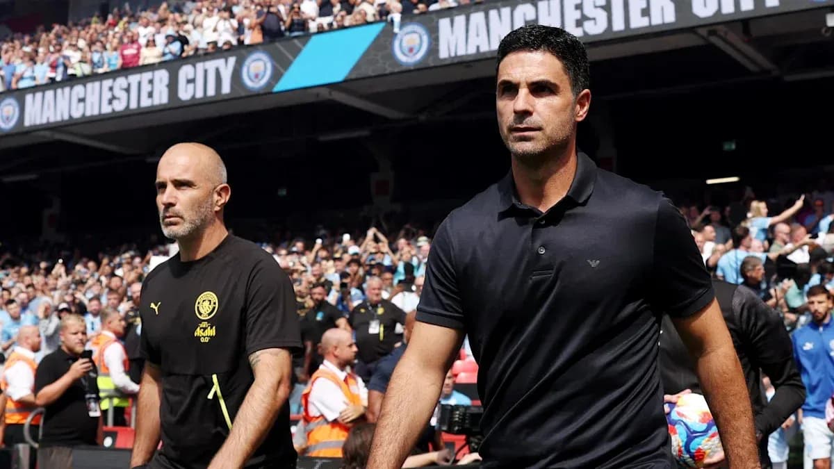 Coaches walking towards the pitch at Manchester City Coaches walking towards the pitch at Manchester City