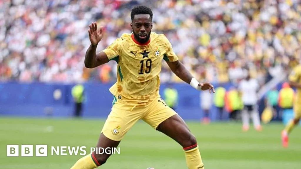 Ghana player in action during a football match Ghana player in action during a football match