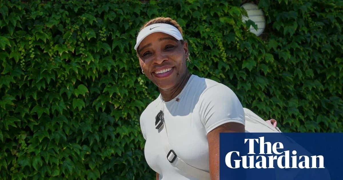 Tennis player smiling in front of green ivy wall Tennis player smiling in front of green ivy wall