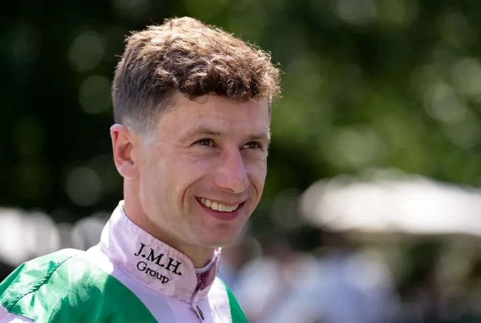 Jockey smiling in paddock before race Jockey smiling in paddock before race