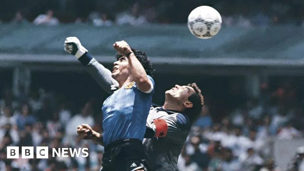 Goalkeeper jumping to catch the ball during match Goalkeeper jumping to catch the ball during match