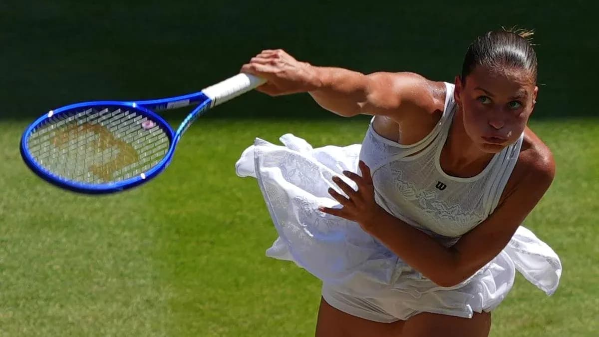 Tennis player serving during a match on grass court Tennis player serving during a match on grass court