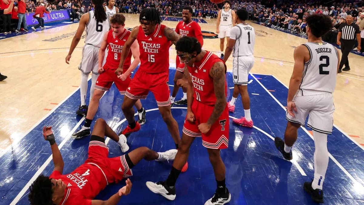 Texas Tech players celebrating after a play during game Texas Tech players celebrating after a play during game