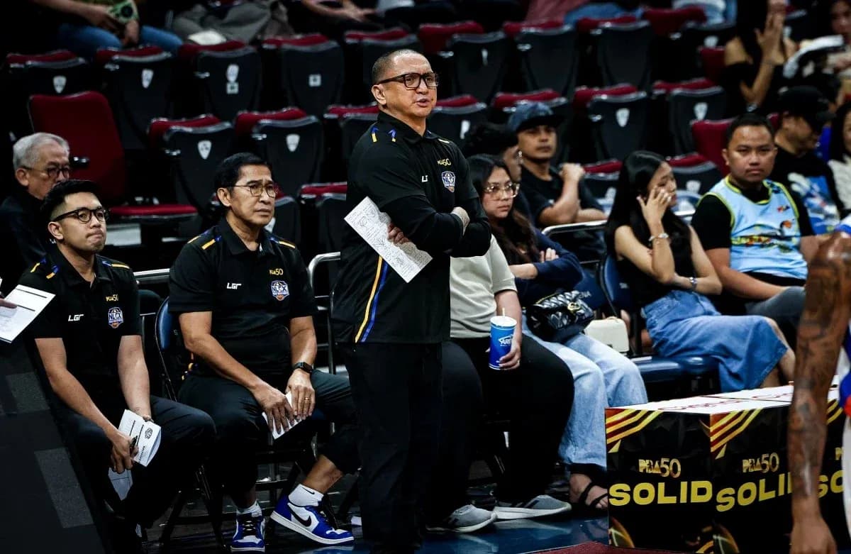 Coaches observing the game from the sidelines Coaches observing the game from the sidelines