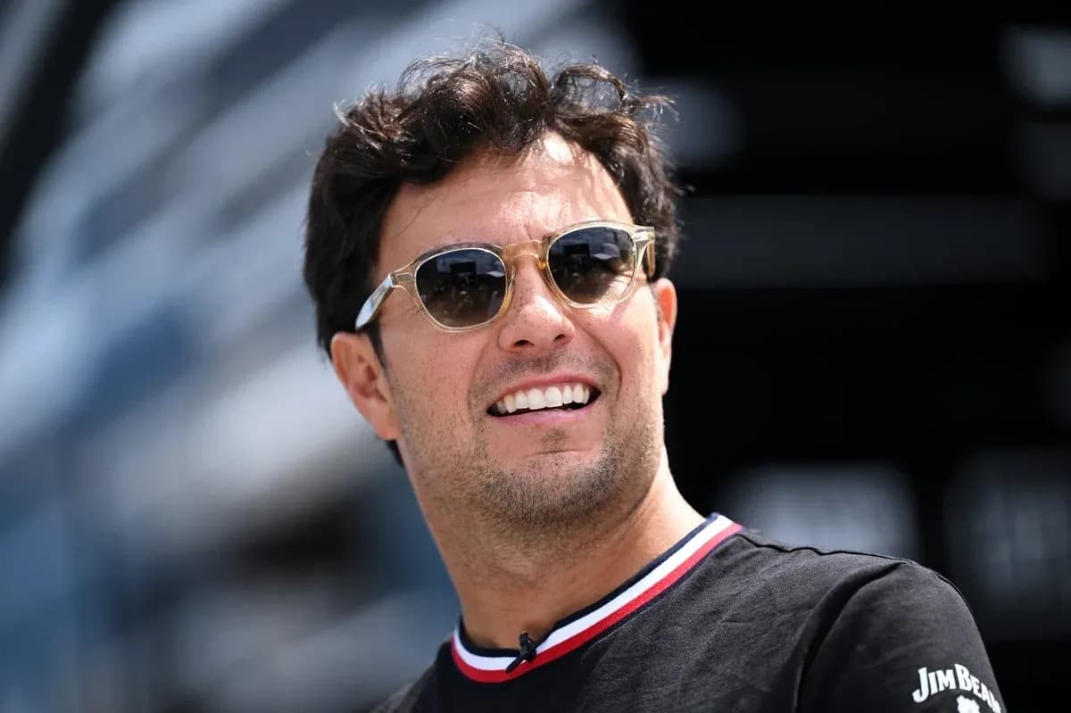 Jovial man wearing sunglasses at a racing event Jovial man wearing sunglasses at a racing event