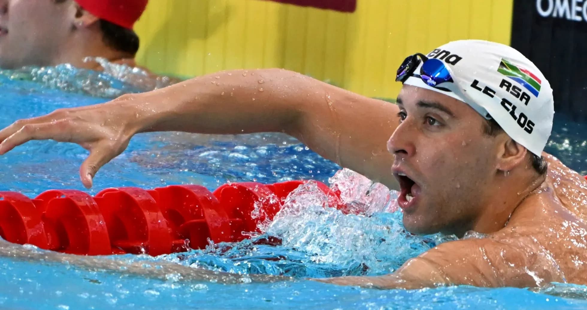 Siz swimmer finishing race at swimming competition Siz swimmer finishing race at swimming competition