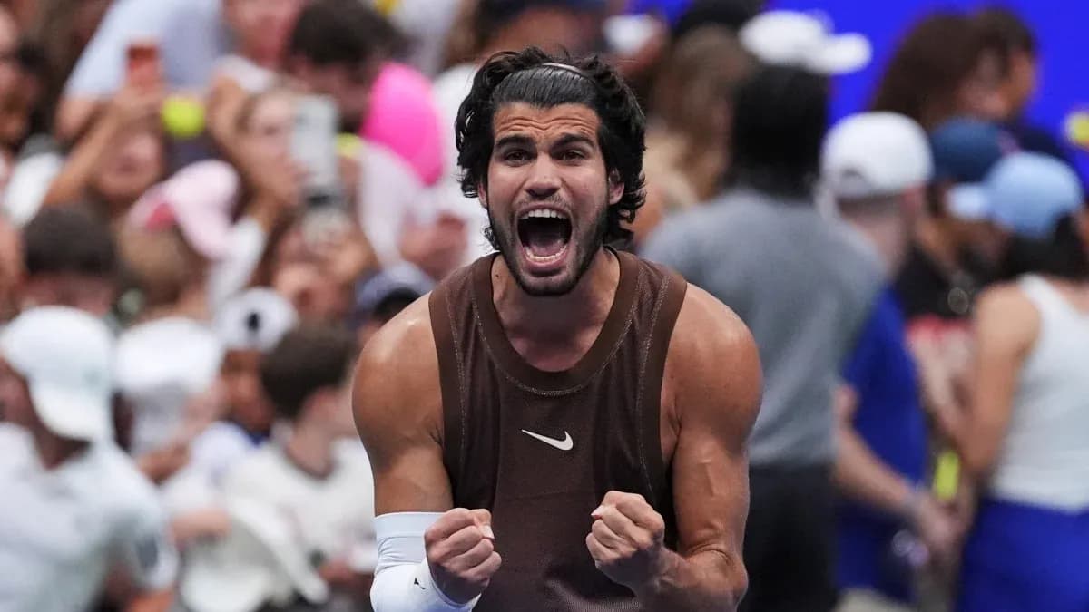 Tennis player celebrating victory in front of crowd Tennis player celebrating victory in front of crowd