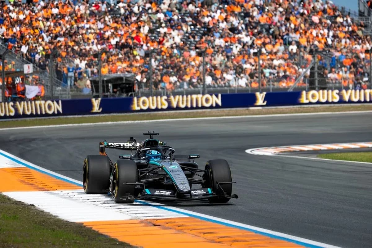 Formula 1 car racing on track with spectators Formula 1 car racing on track with spectators