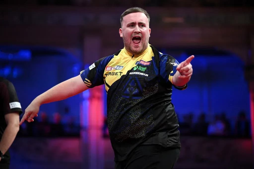 Dart player celebrating a successful throw on stage Dart player celebrating a successful throw on stage