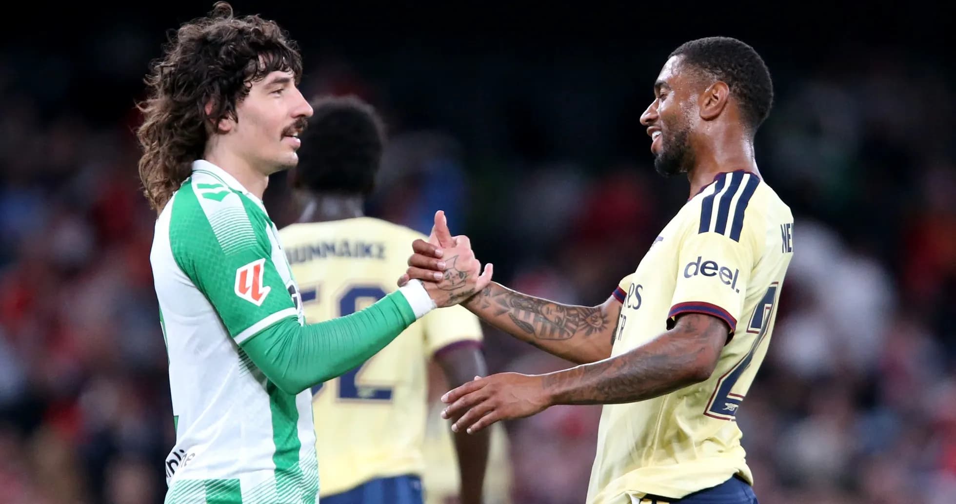 Two football players shaking hands after match Two football players shaking hands after match