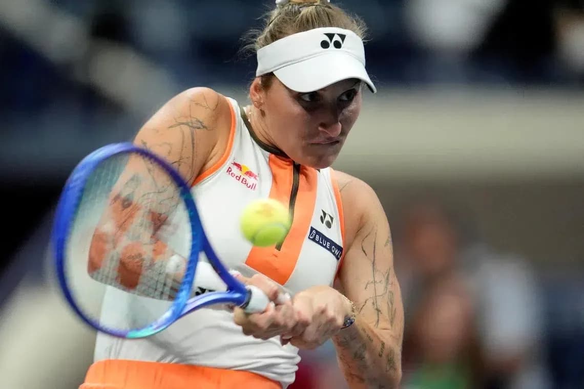 Tennis player hitting a forehand during match Tennis player hitting a forehand during match