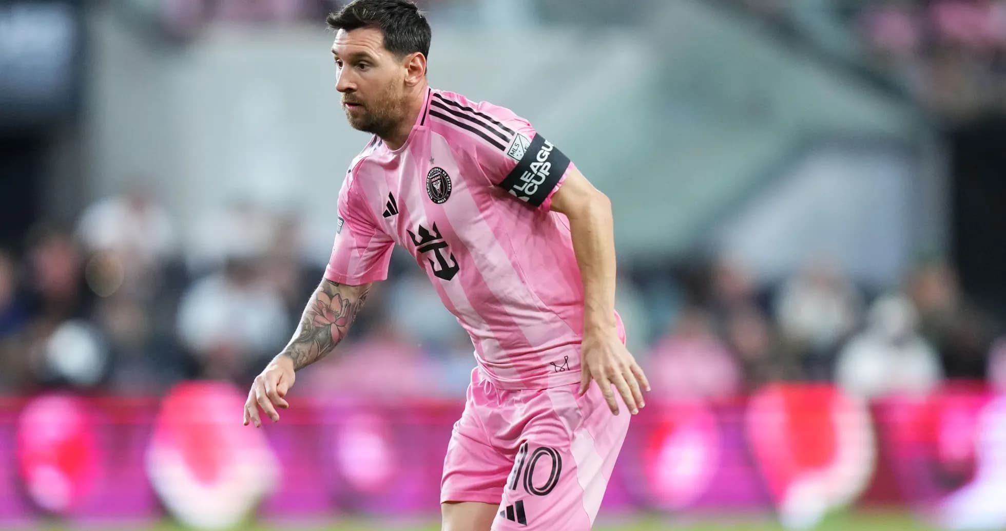 Lionel Messi playing for Inter Miami in pink uniform Lionel Messi playing for Inter Miami in pink uniform