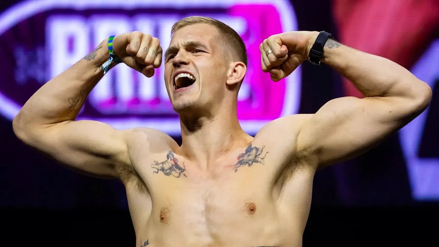 Athlete flexing muscles during weigh-in event Athlete flexing muscles during weigh-in event