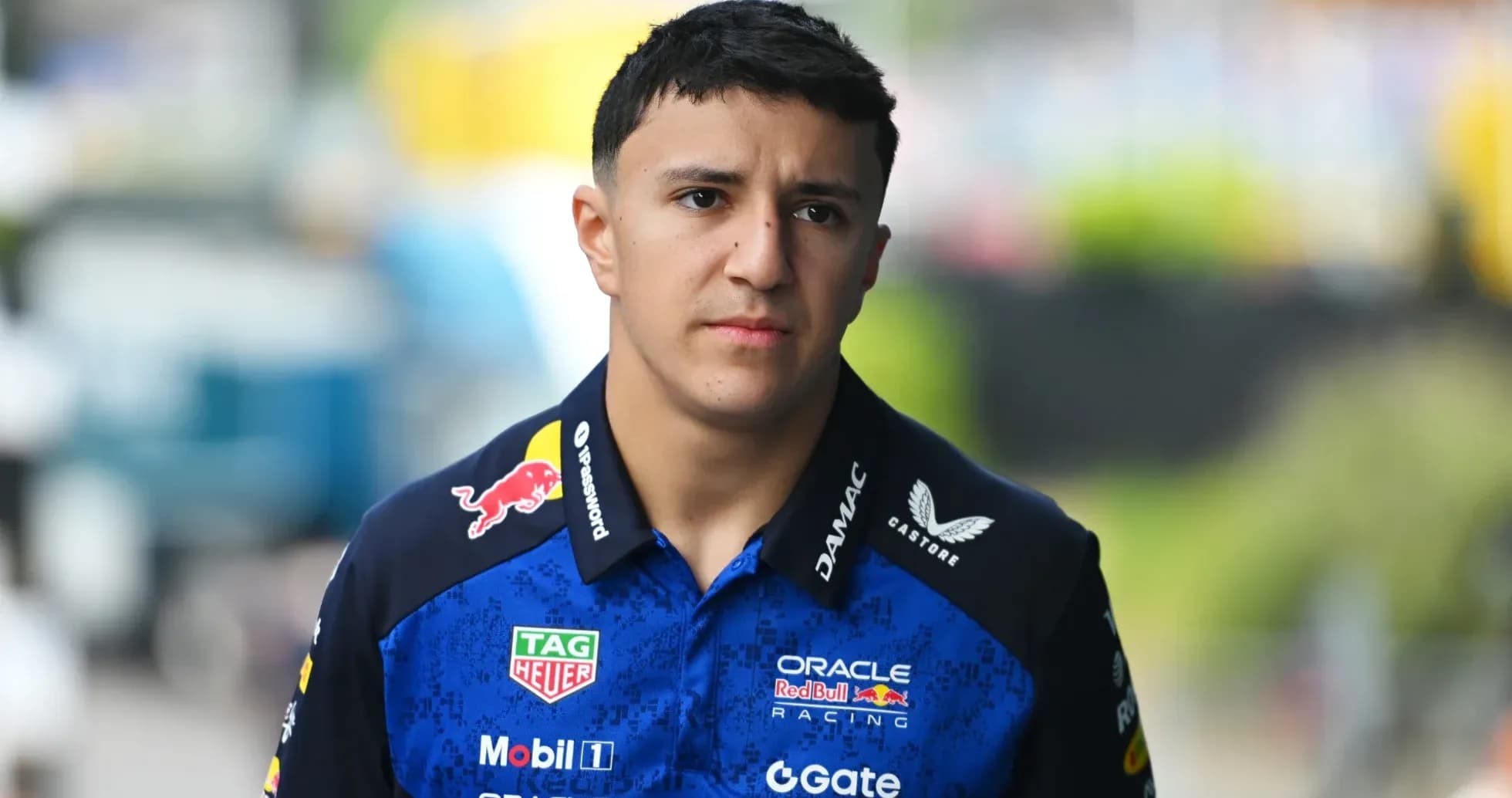 F1 driver walking in team uniform before race F1 driver walking in team uniform before race