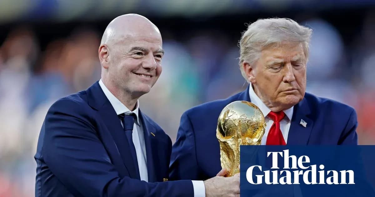 Gianni Infantino and Donald Trump holding World Cup trophy Gianni Infantino and Donald Trump holding World Cup trophy