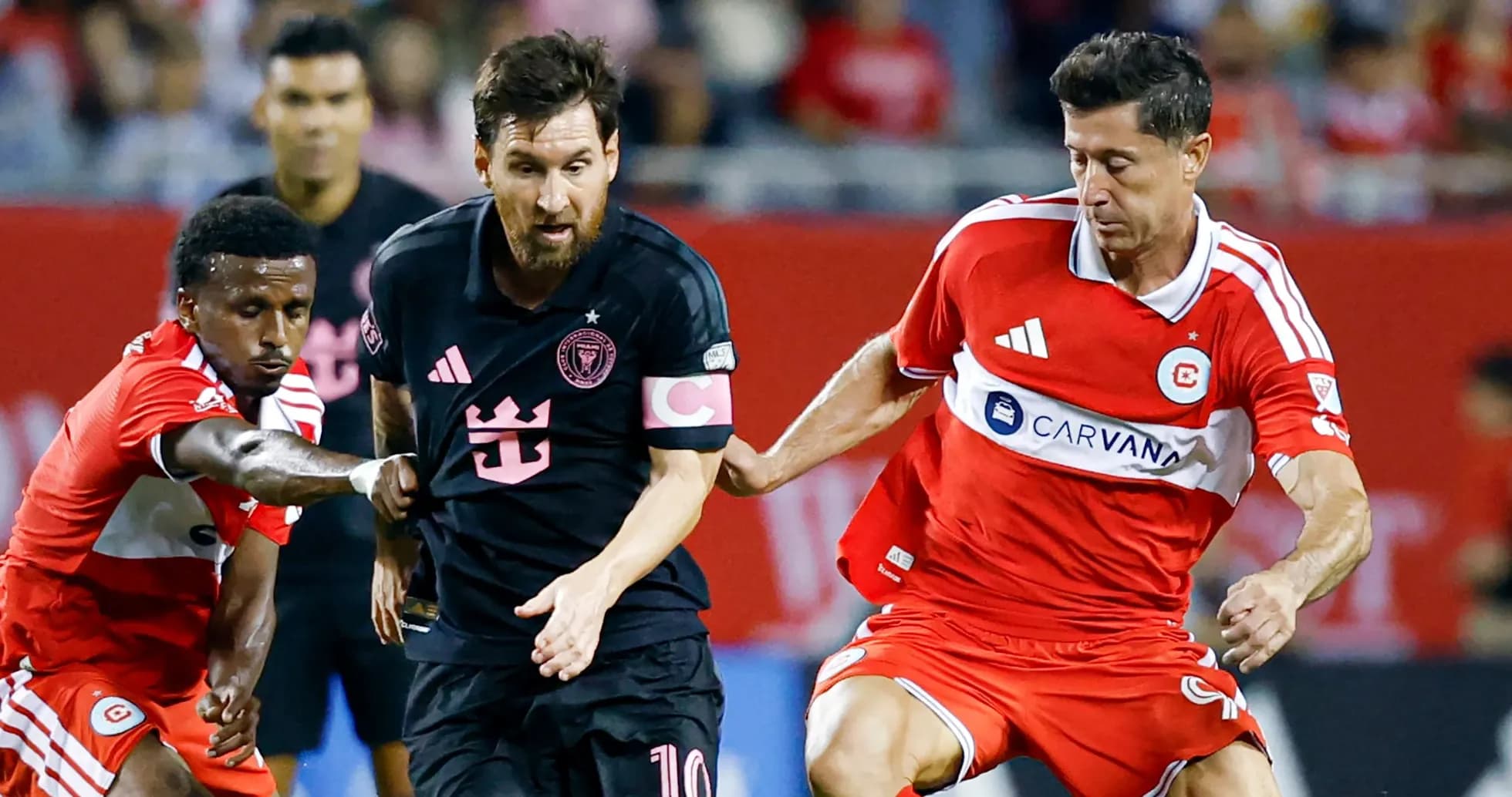 Messi dribbling past defenders during soccer match Messi dribbling past defenders during soccer match