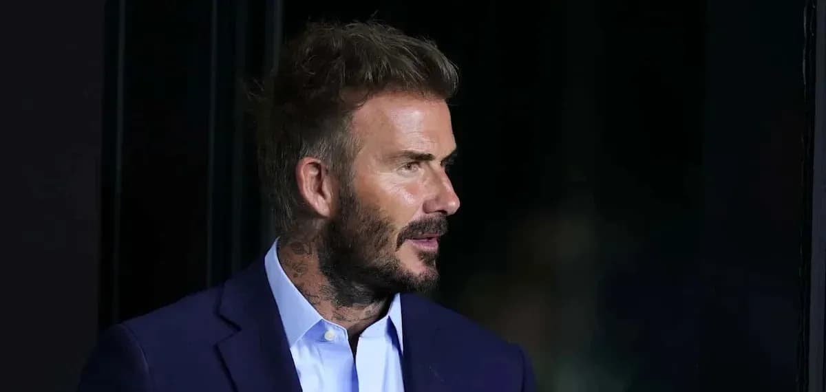 Man in suit with tattoos at an event Man in suit with tattoos at an event