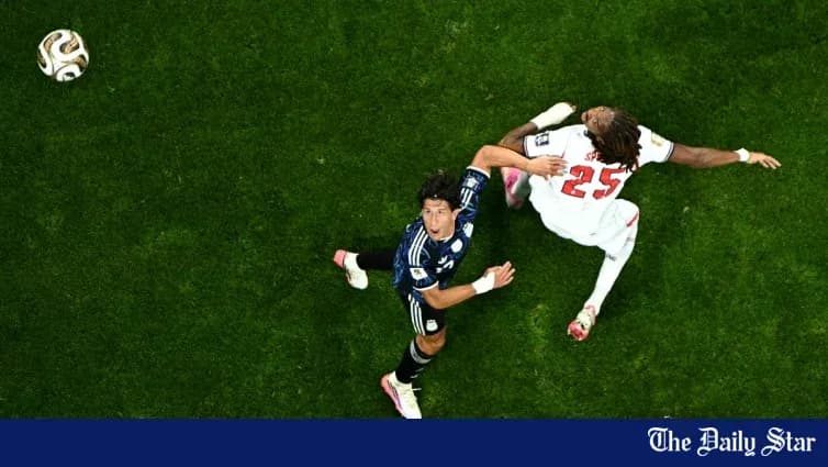Player challenging for the ball during a match Player challenging for the ball during a match