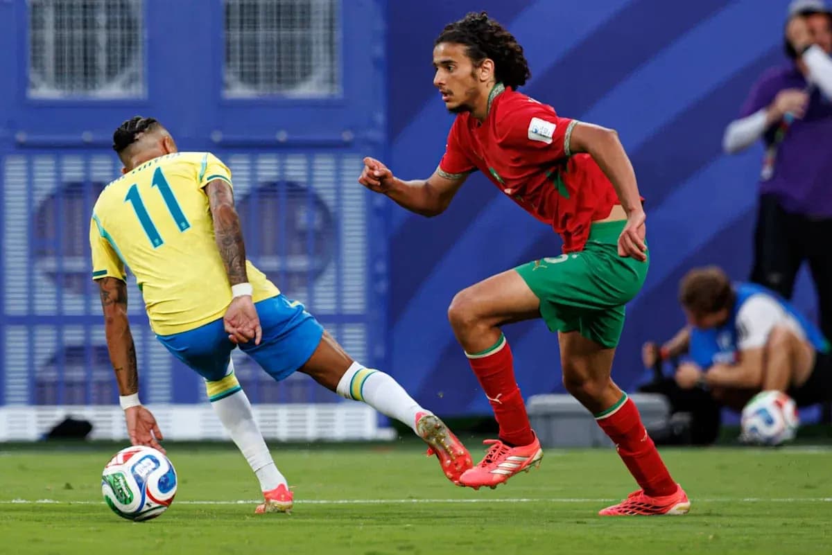 Brazilian player dribbling past Moroccan defender Brazilian player dribbling past Moroccan defender