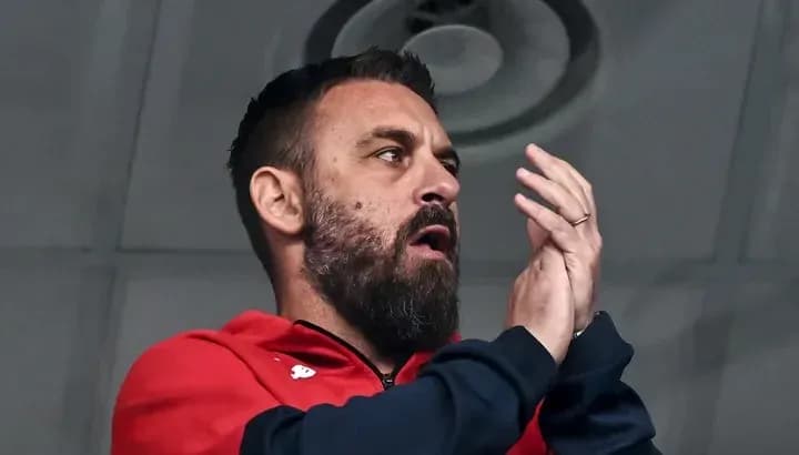 Coach applauding from the stands during match Coach applauding from the stands during match