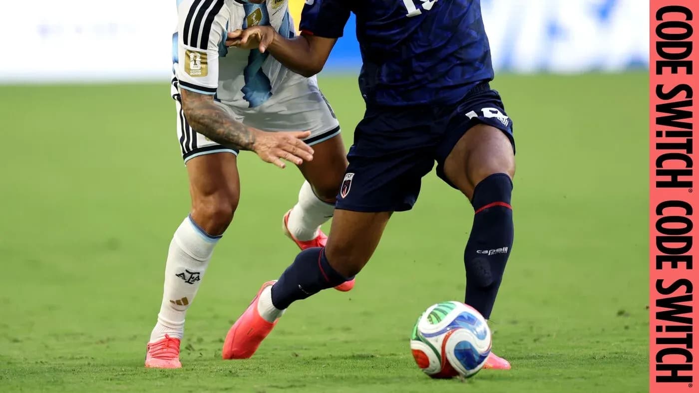 Two players contesting the ball during a match Two players contesting the ball during a match