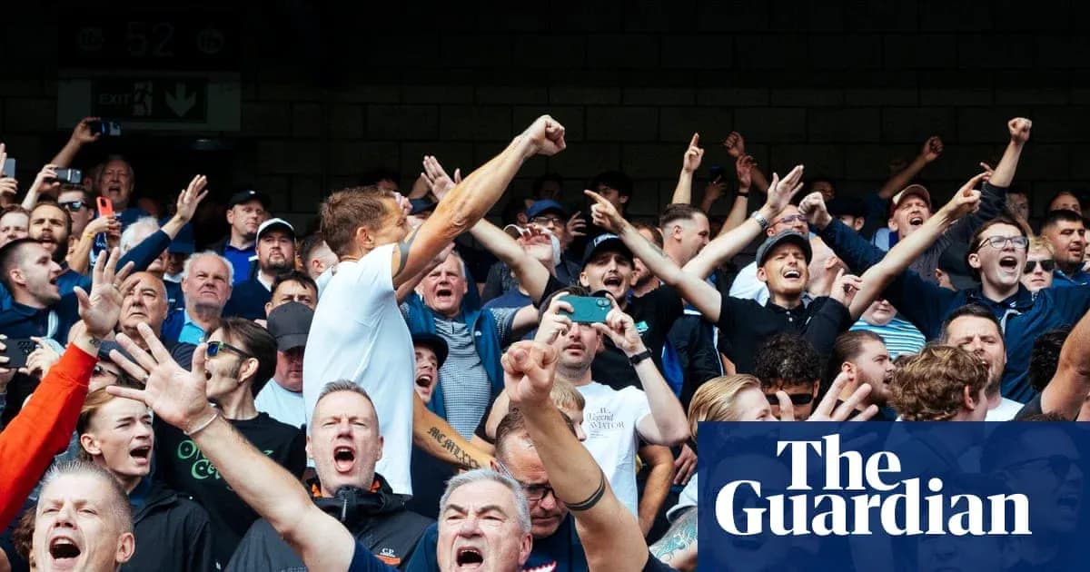 Football fans cheering and celebrating in stadium Football fans cheering and celebrating in stadium