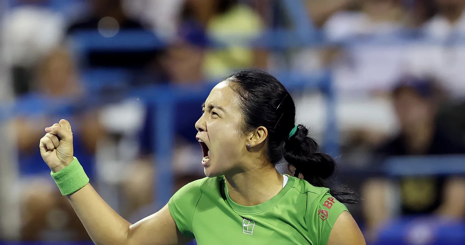 Tennis player celebrating with a clenched fist Tennis player celebrating with a clenched fist