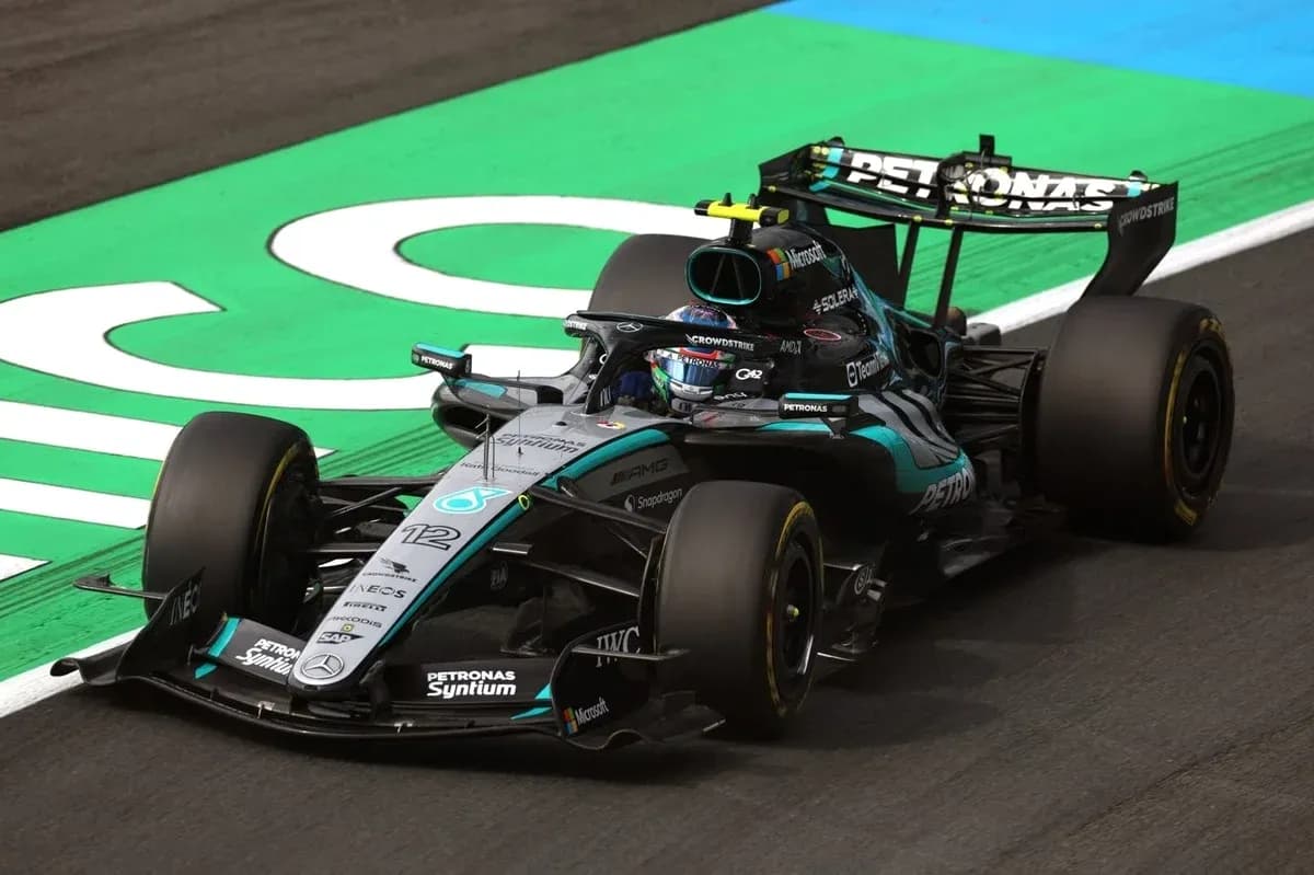 Mercedes Formula 1 car racing on track Mercedes Formula 1 car racing on track