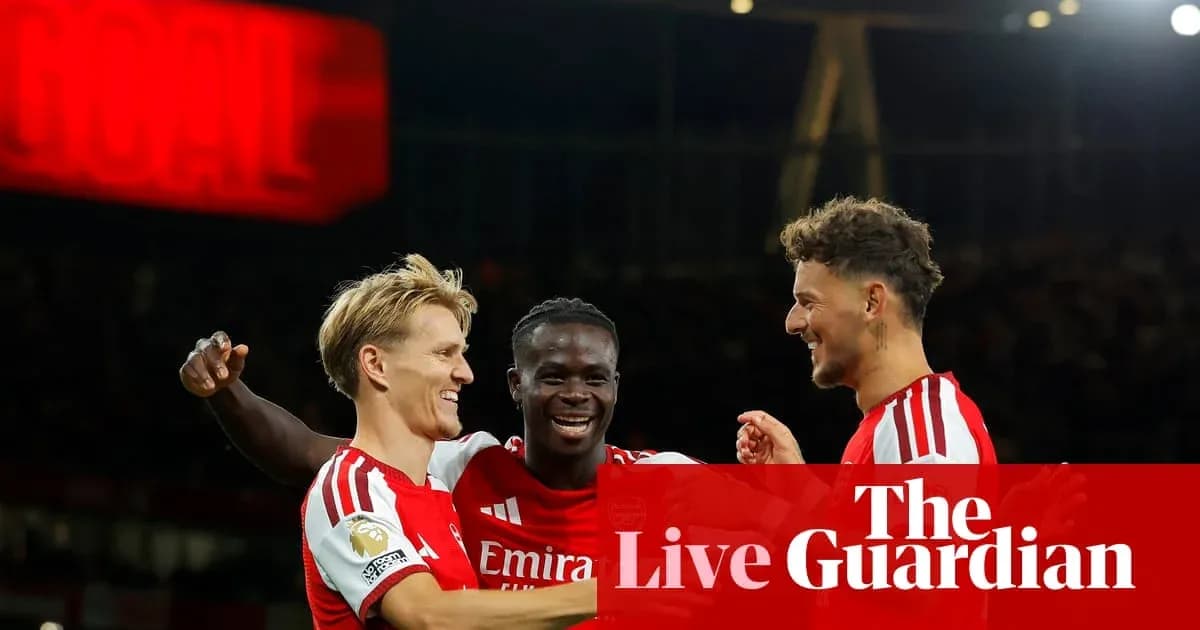 Arsenal players celebrating a goal during a match Arsenal players celebrating a goal during a match