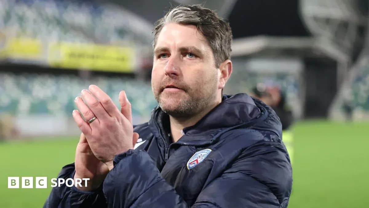 Coach applauding fans after a match Coach applauding fans after a match