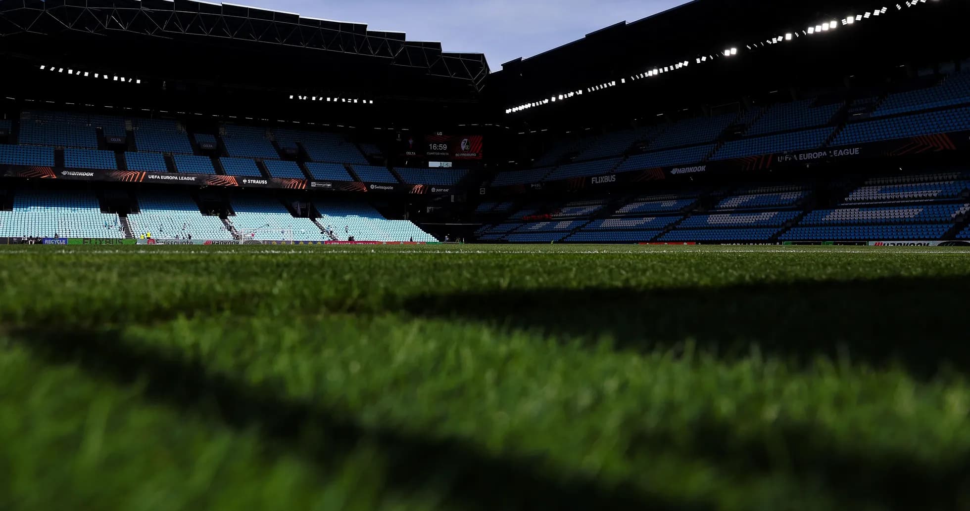 Stadium field view with empty seats before match Stadium field view with empty seats before match