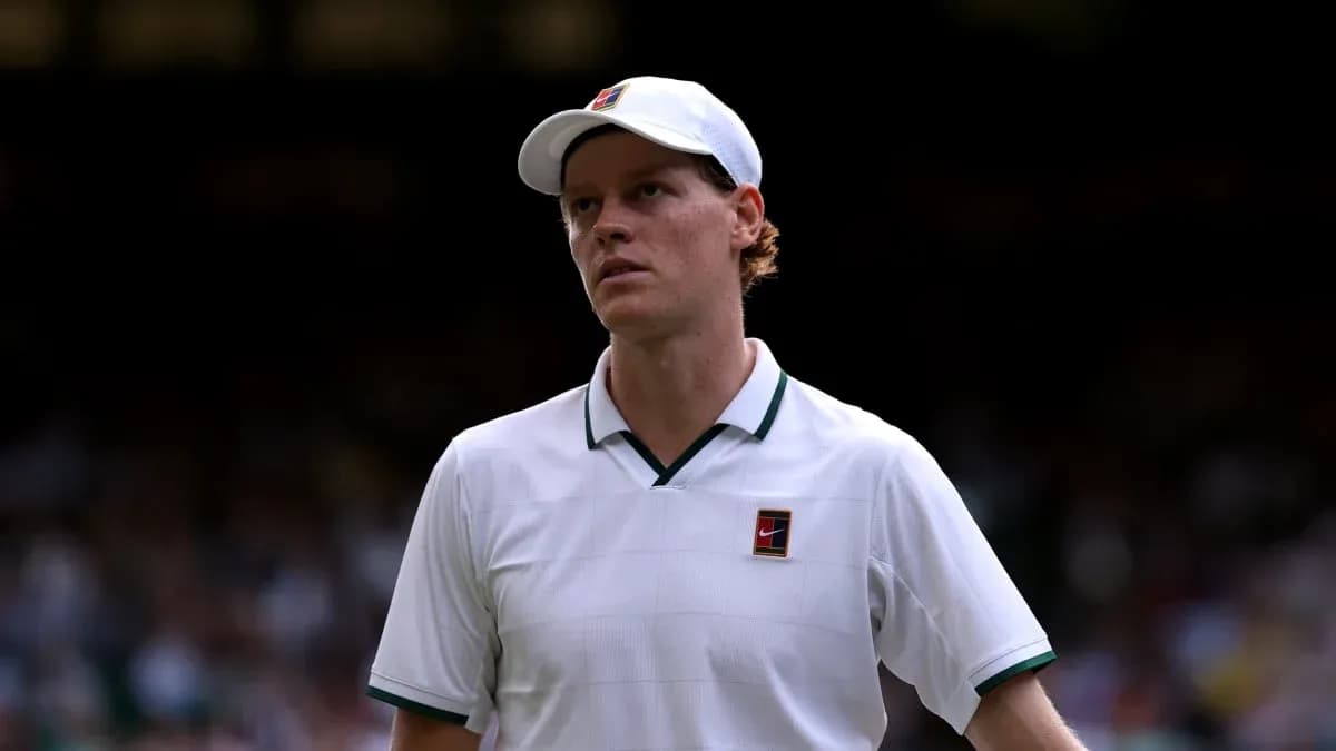 Tennis player walking on court at Wimbledon Tennis player walking on court at Wimbledon