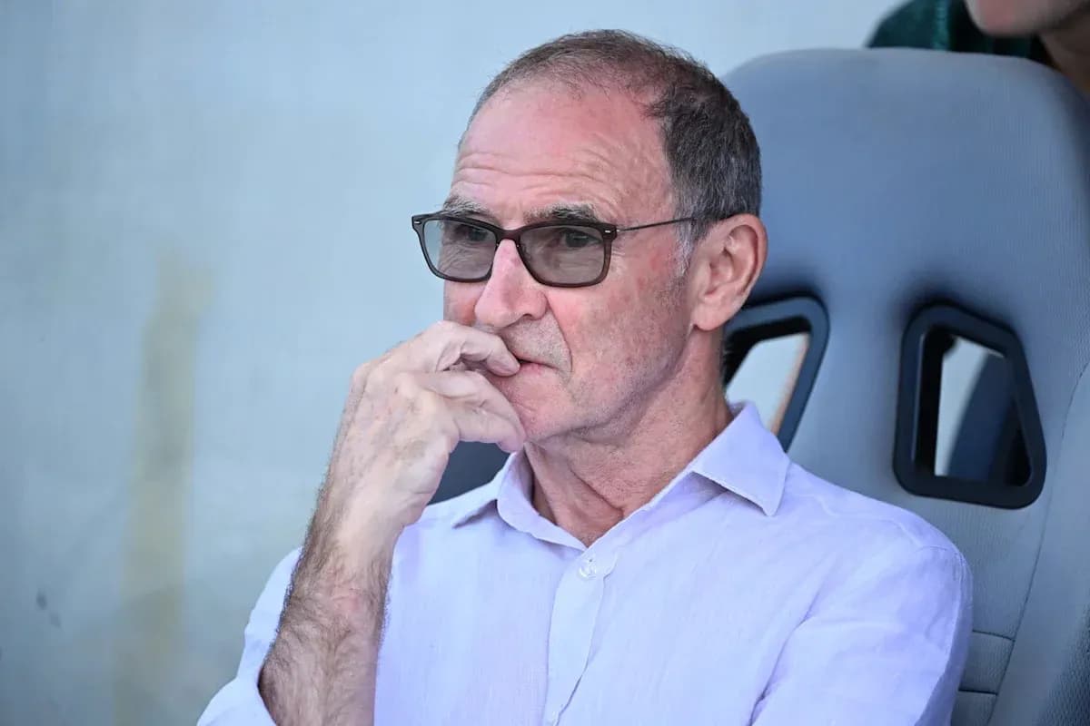 Person seated in dugout, wearing glasses and thinking Person seated in dugout, wearing glasses and thinking