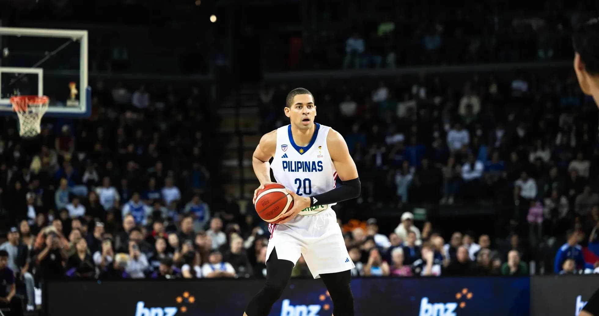 Basketball player dribbling ball on court Basketball player dribbling ball on court