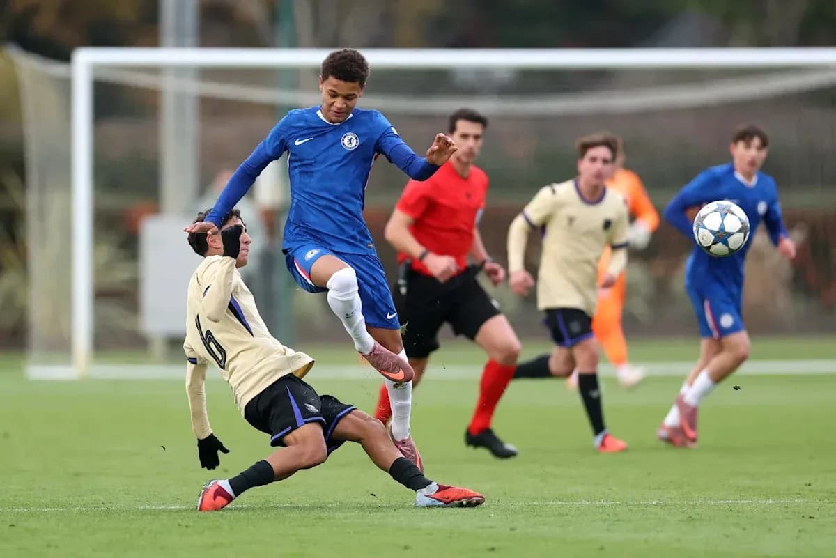 Player in blue evading a tackle during match Player in blue evading a tackle during match