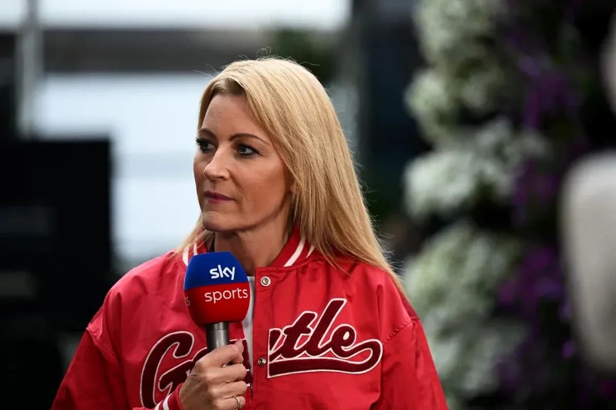 Television presenter speaking into microphone on set Television presenter speaking into microphone on set