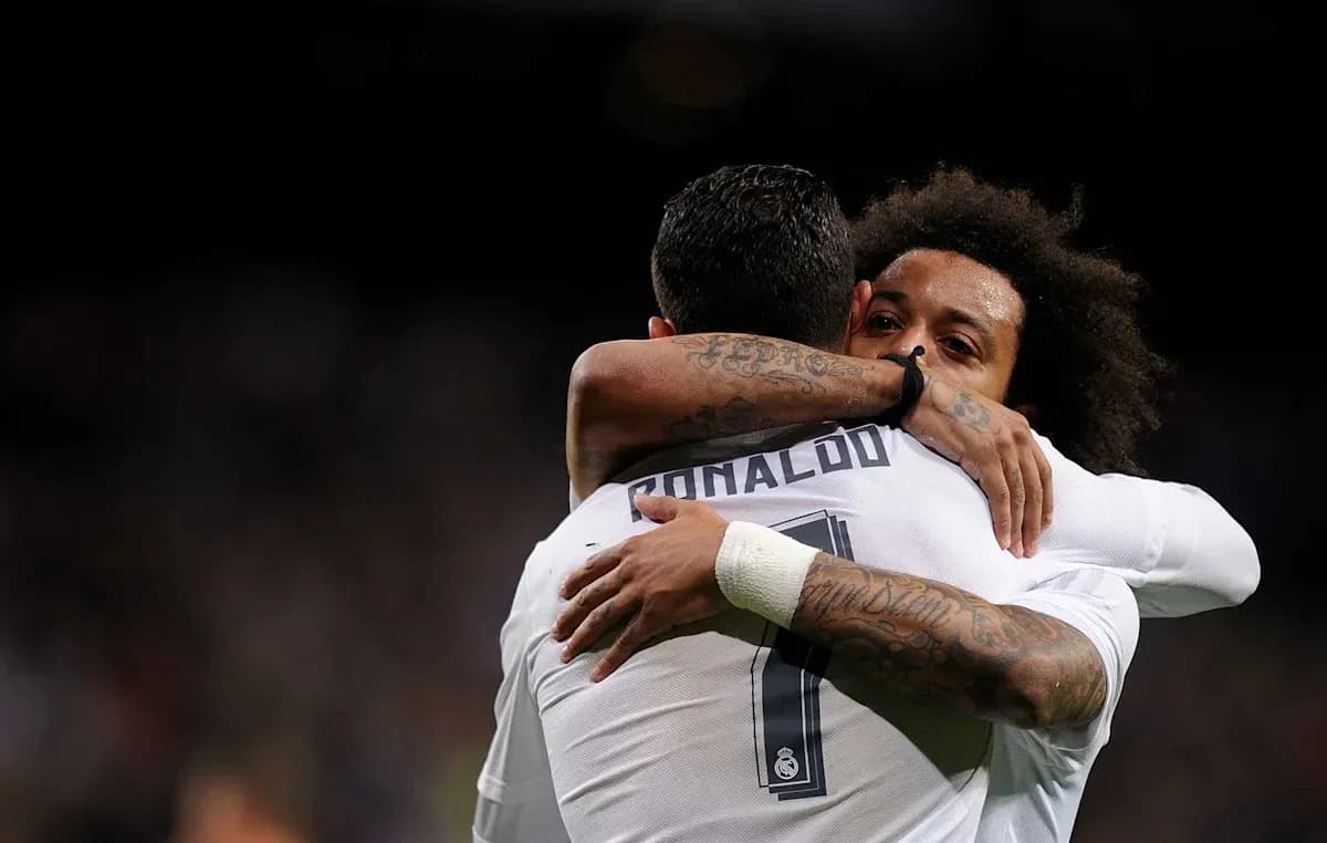 Cristiano Ronaldo and Marcelo hugging on the pitch Cristiano Ronaldo and Marcelo hugging on the pitch