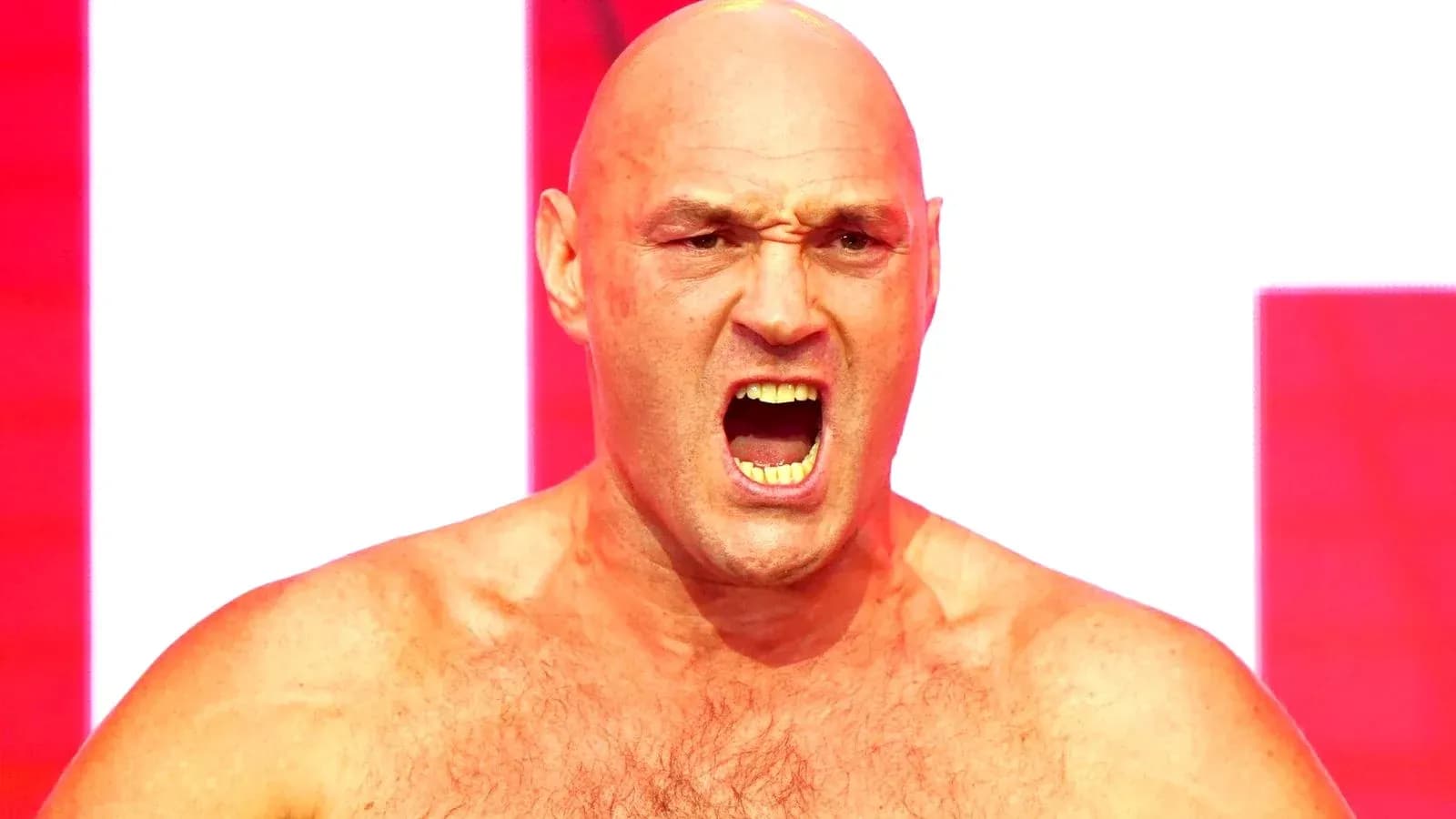 Bald fighter shouting on stage with red background Bald fighter shouting on stage with red background