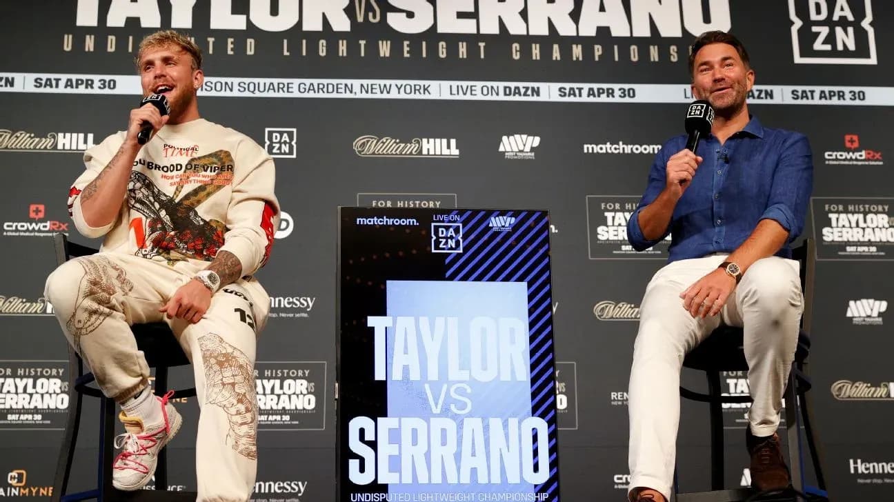 Jake Paul and promoter discussing fight details at podium Jake Paul and promoter discussing fight details at podium
